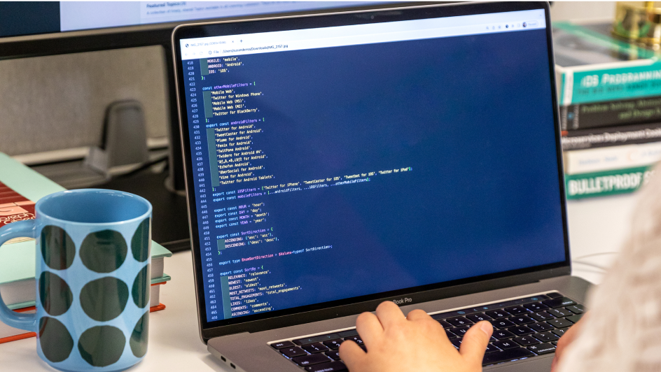 Over the shoulder of an engineer writing code for our platform.